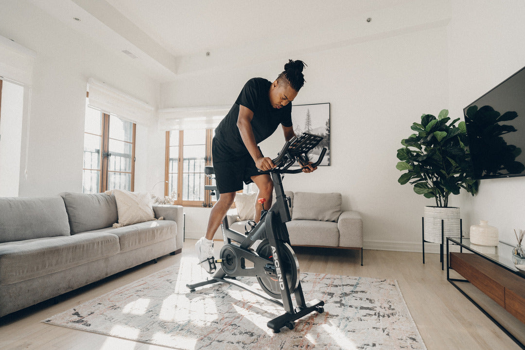 man on indoor spin bike doing HIIT workout